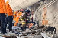 Indonesian rescuers search for missing students after school coll...