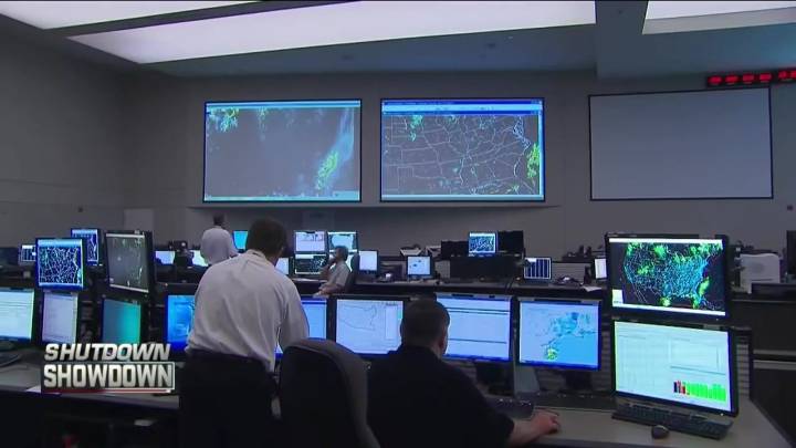 Travelers at Logan react to delayed flights due to staff shortages with air traffic control