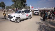 Hamas returns bodies of 4 more hostages after Israel threatens aid cut