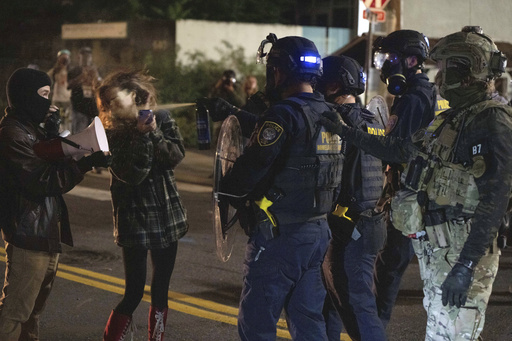 Portland braces for federal troops as protests escalate and conservative influencer is arrested