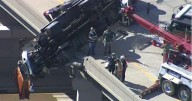 Tow truck dangles off McKinney overpass in dramatic crash