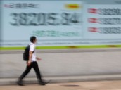 Asian stocks surge as trade tensions ease, Nikkei hits record