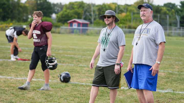 Luke and Bruce Scifres coach side-by-side at Covenant Christian High School