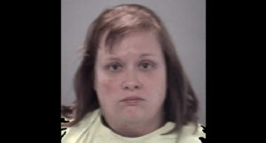 Teacher charged with homicide after calling police to report death of son