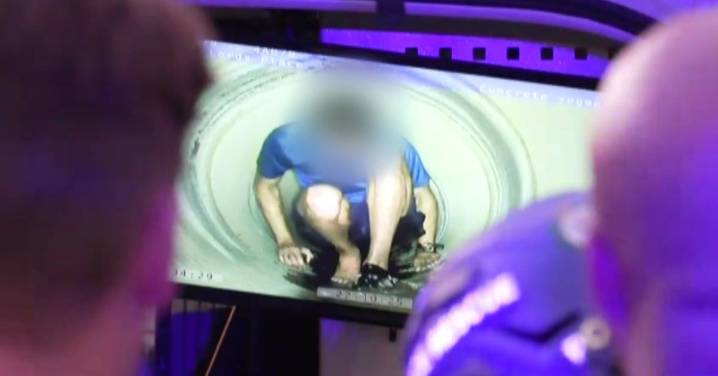 NSW news: Man wanted on domestic violence charges allegedly found hiding in a drain