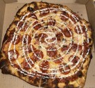 New bar Hustlin’ Heights offers ‘killer pies’ and community in Muskegon Heights