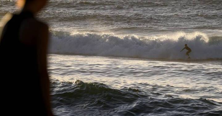 Warning after deaths of surfer and friend in wild winds