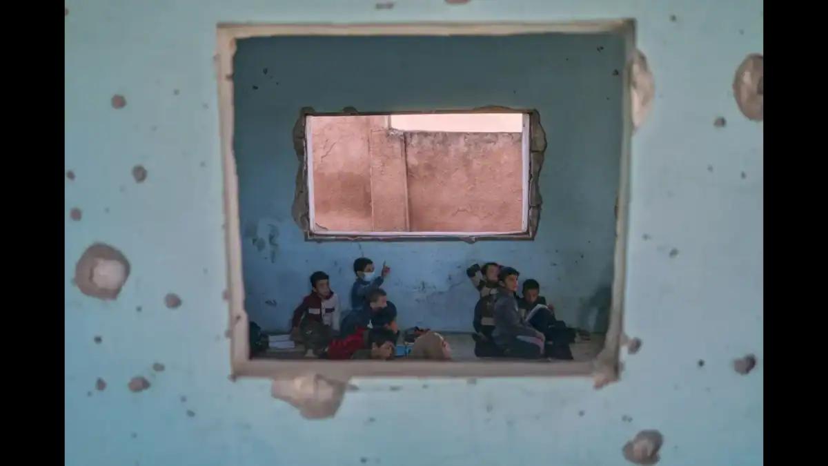 Syrian children resume classes in schools stripped bare by conflict