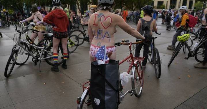Naked bike riders demonstrate against federal troops