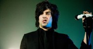 Ian Watkins spotted 'kissing young groupies' while visiting paedo in prison