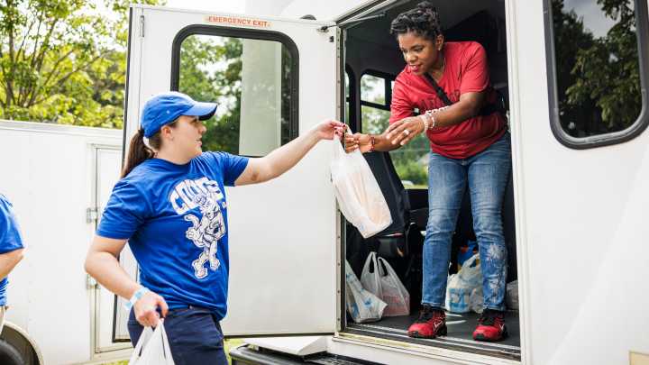 BYU fans collecting shoes at Iowa State tailgate in Ames