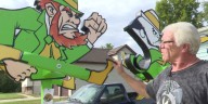 Notre Dame fan crafts giant leprechaun whirligigs