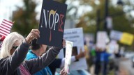 Mad with different messages. Hundreds attend No Kings rally in Falls