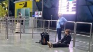 Foreign woman sitting on floor at Thiruvananthapuram airport; image ignites discussion on social media