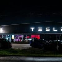 Tesla profits tumble on higher costs, tariff drag