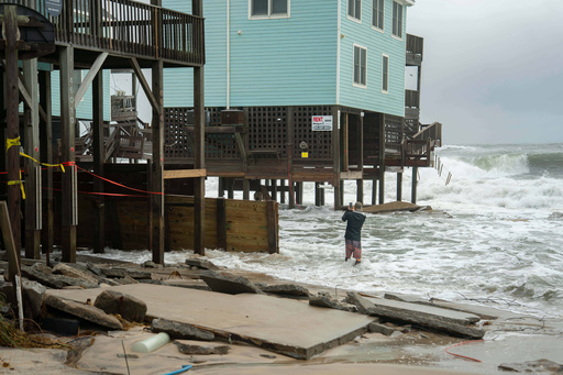Dozens rescued as remnants of typhoon hits Alaska while nor'easter brings flooding to East Coast