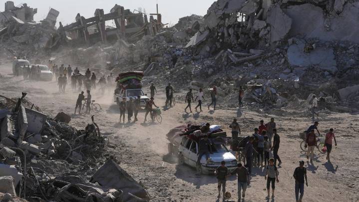 Some Palestinians pack up and move north toward their homes in Gaza after ceasefire goes into effect