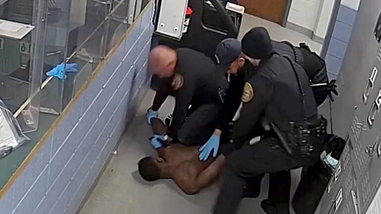 Ex-Mass. police captain arrested in alleged booking room assault