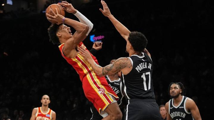 Jalen Johnson and Hawks hold off winless Nets 117-112 after Trae Young exits with knee injury