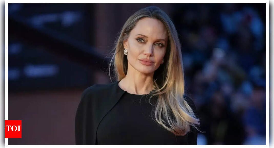 Angelina Jolie shows off back tattoo in backless dress at 'Couture' premiere