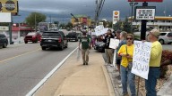 Hundreds of 'No Kings' protesters withstand rain in Branson