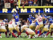 Short-handed 49ers stop Rams on downs in overtime, preserving a 26
