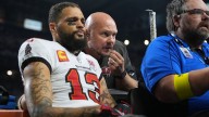 Lions beat Bucs 24-9, Evans leaves with broken collarbone