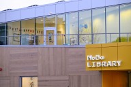 NoBo library branch was closed and the alarm was going off. Bookworms were inside anyway.