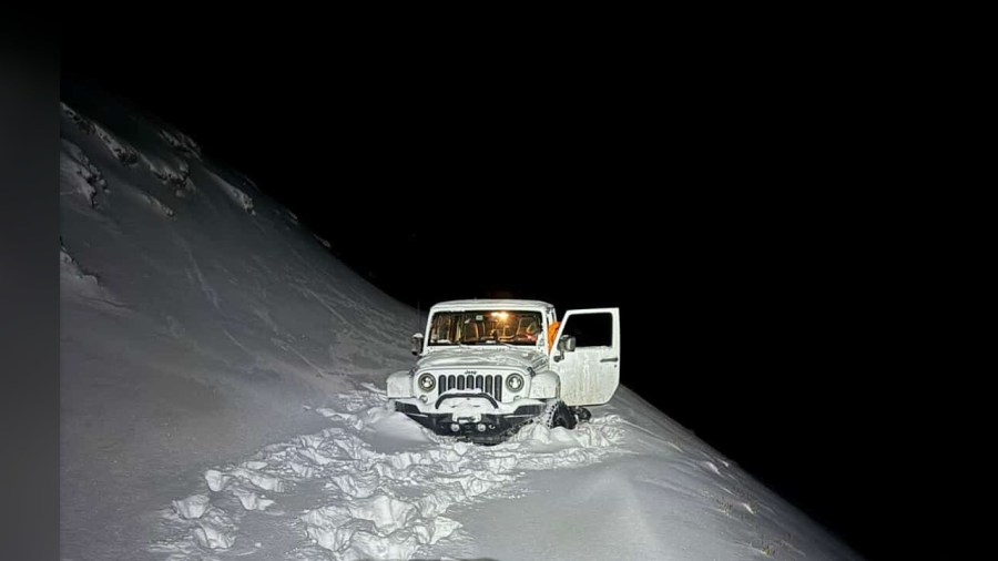 Photos: Florida dad, son rescued after snow strands vehicle on Engineer Pass summit