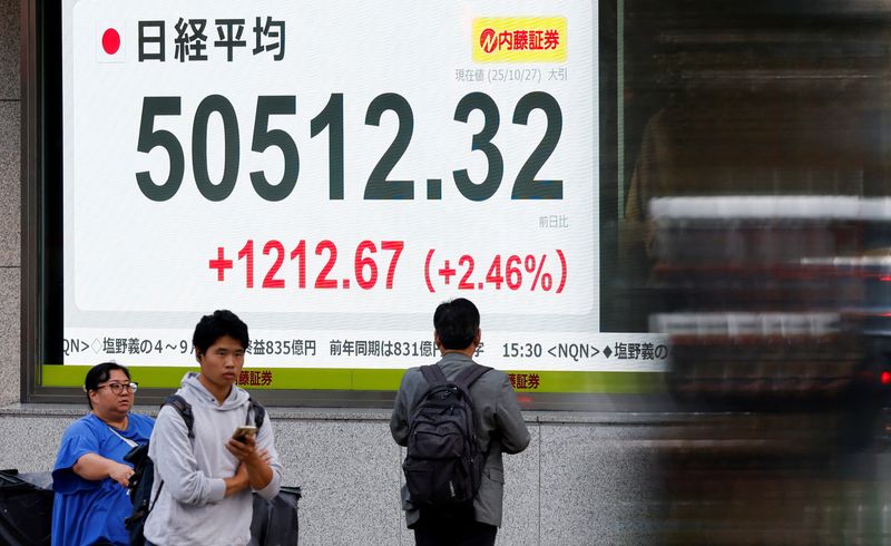 Japan's Nikkei tops 50,000 mark for first time on stimulus euphoria