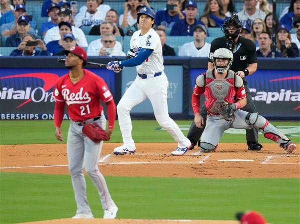 Ohtani, Hernandez power Dodgers past Reds 10-5 with 2 homers each in Wild Card series opener