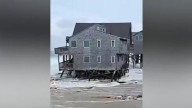 Bermuda lashed by distant hurricane and prepares for the stronger Imelda