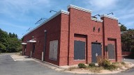 Boarded-up former KFC on Patterson Ave. purchased by car wash owner