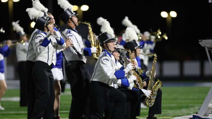 Photos of the Dundee and Ida bands during their rivalry football game