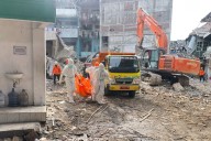 Indonesian rescuers search for missing students after school collapse kills 49