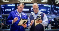 Wall Street takes back some of Friday's losses as Trump softens tone on China trade talks