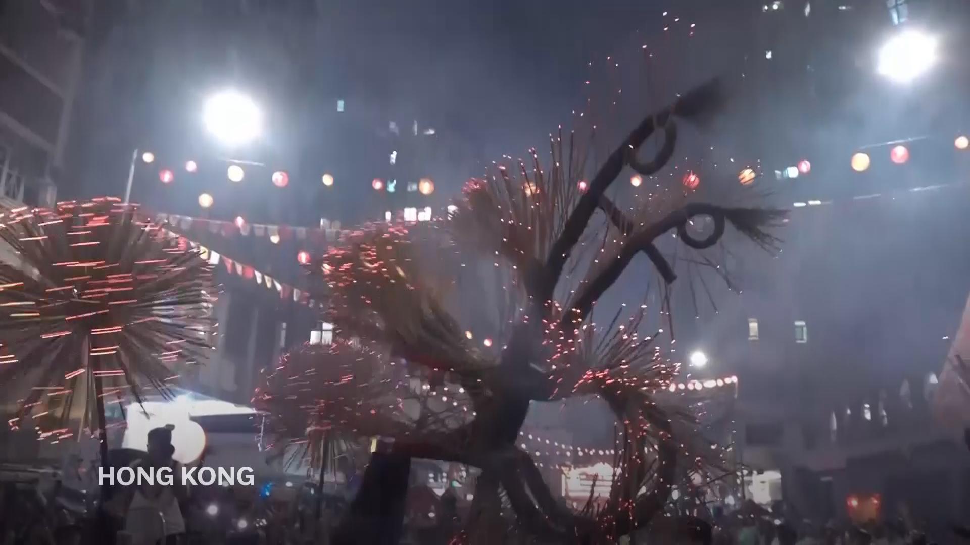 Dragon made of 10,000 incense sticks dances through Hong Kong