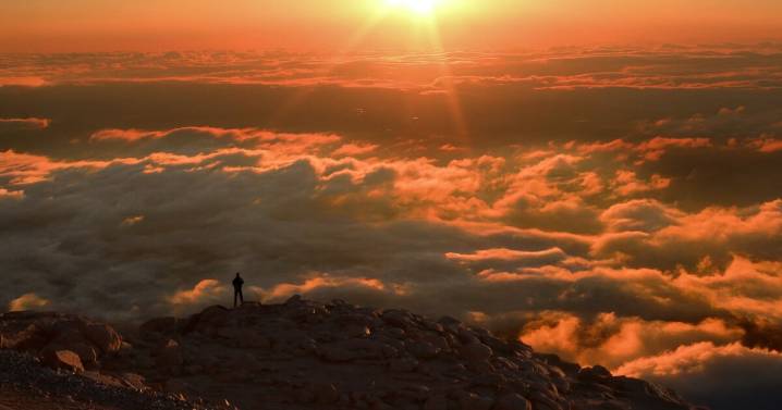 Cool and breezy Monday with more mountain rain and isolated plains showers