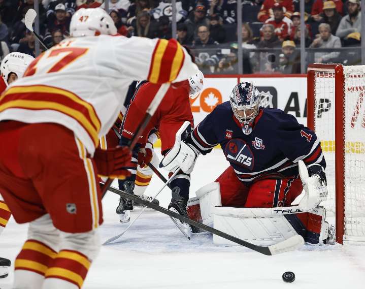 Jets use power play to soar past Flames 5