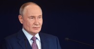 Putin deplores U.S. sanctions as "unfriendly"