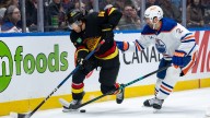 Sherwood scores in overtime as Canucks slip past Oilers