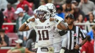 Reed throws for 280 yards and 3 TDs, runs for another score as No. 4 Texas A&M beats Arkansas 45