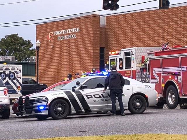 Driver transported to hospital after wreck near Forsyth County high school