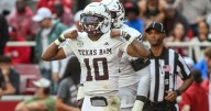 Reed throws for 280 yards and 3 TDs, runs for another score as No. 4 Texas A&M beats Arkansas 45