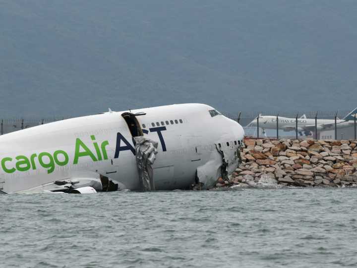 Cargo plane skids off Hong Kong runway into sea