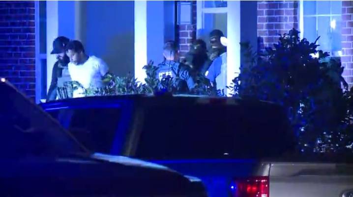 Man in handcuffs escorted from South Memphis home