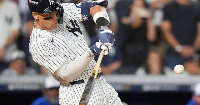 Judge rallies Yankees past Blue Jays 9-6 to save season and avert ALDS sweep
