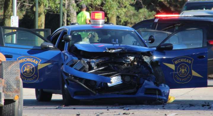 State trooper injured in crash with car hauler near Ann Arbor