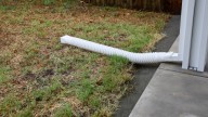 How To Turn The Eyesore Of A Downspout Into An Elegant Landscaping Feature