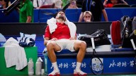 Djokovic collapses in Shanghai sweatbox but still wins